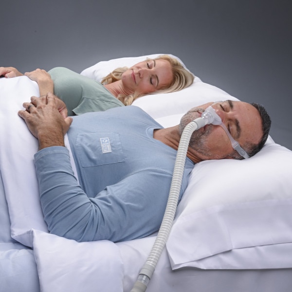 Couple in bed with Delta Wave CPAP
